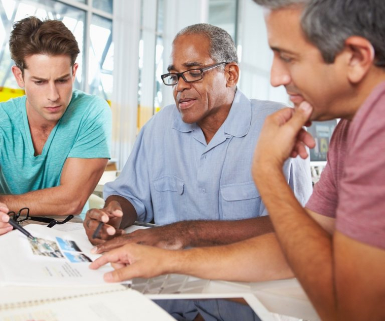 group-of-men-meeting-in-creative-office-PXEKFW4-768x640